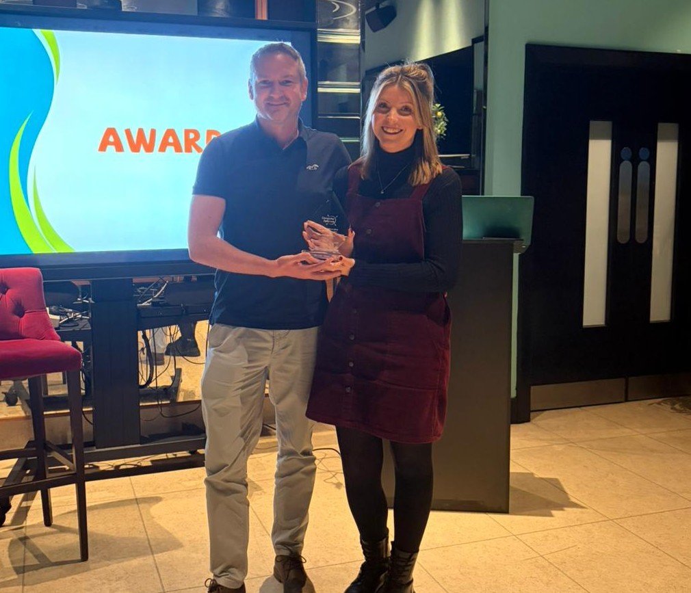 martin and lisa holding franchisee award trophy for 2025